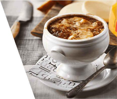 A bowl of French onion soup with cheese