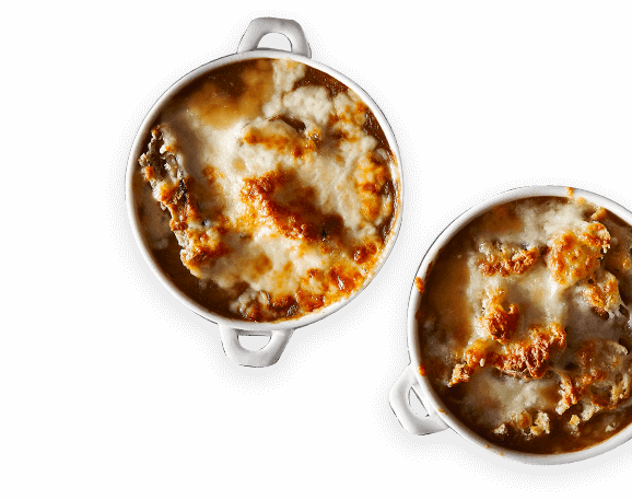 Overhead view of 2 bowls of French onion soup